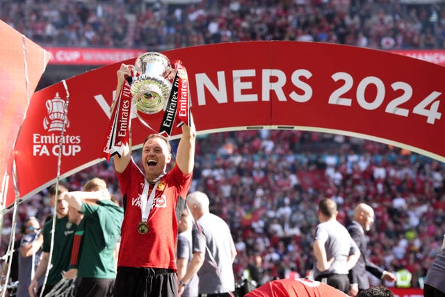 Manchester United’s Jonny Evans celebrates with the FA Cup after victory over Manchester City at Wembley