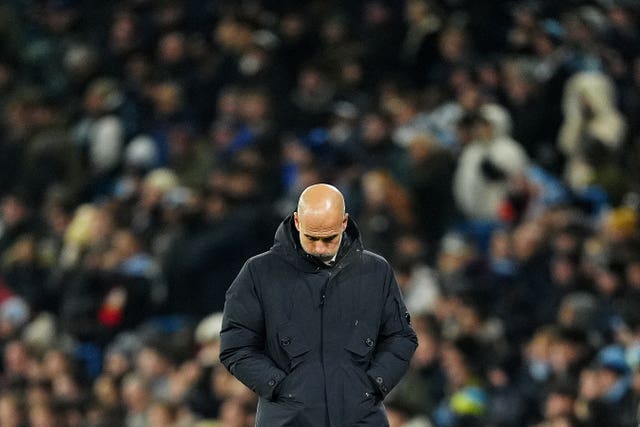 Manchester City manager Pep Guardiola bows his head in frustration on the touchline