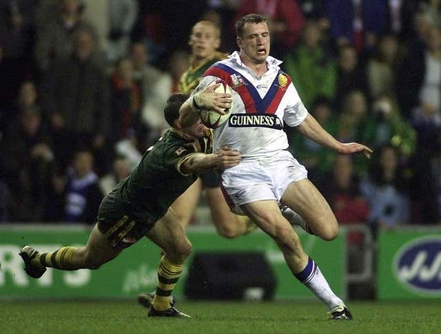 Great Britain’s Jamie Peacock is tackled by Australia’s Darren Lockyer during a Test match at Wigan