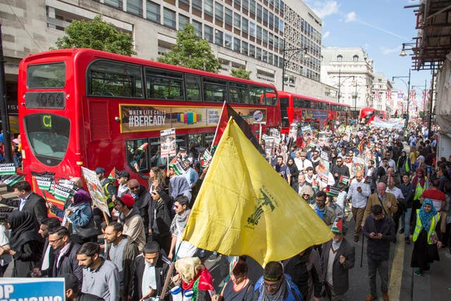 Pro-Palestinian supporters take part in a rally in central London, to commemorate Al-Quds Day, a day that has been marked globally since being inaugurated in 1979 by Ayatollah Khomeini who asked for the last Friday in the Islamic holy month of Ramadan to be set aside as a day for uniting against Israel and showing support for Palestinians.
