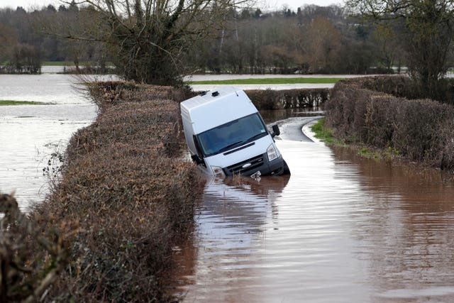 A van sits in floodwater near the village of Hampton Bishop near Hereford, after the River Lugg burst its banks in the aftermath of Storm Dennis 
