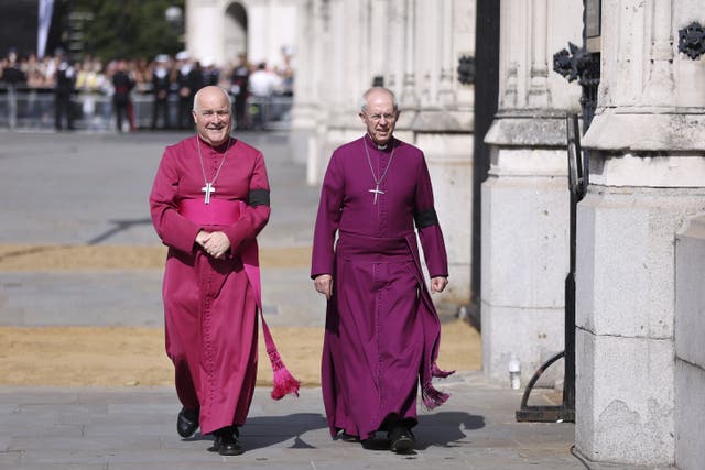 Archbishop of York Stephen Cottrell walks side by side with Archbishop of Canterbury Justin Welby