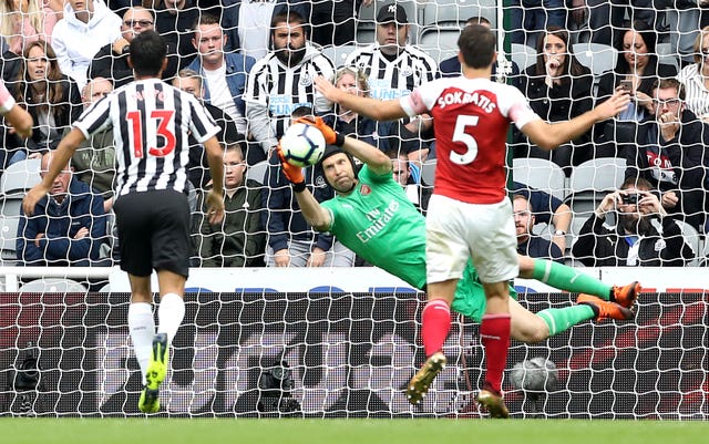 Petr Cech, centre, makes a save against Newcastle