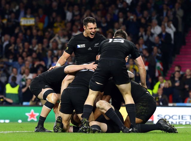 Beauden Barrett is mobbed by his New Zealand team-mates after scoring in the 2015 Rugby World Cup Final against Australia