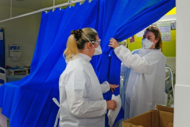 Medical staff wearing protective equipment at a critical care centre during the coronavirus pandemic