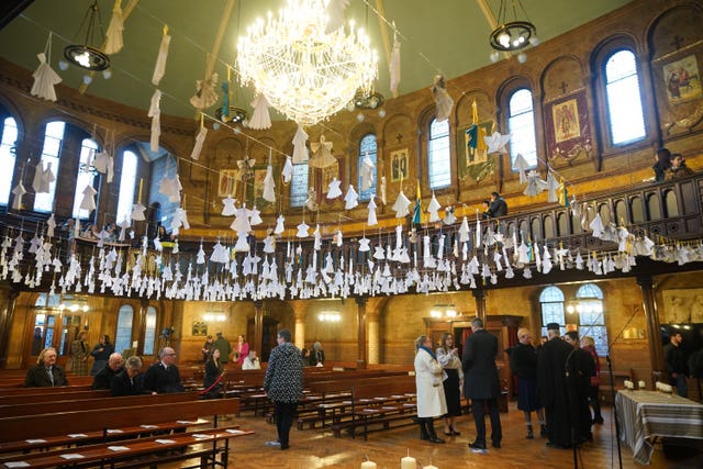Some 461 paper angels hang from the roof, one for each child that has died in the past year according to the official statistics, ahead of an ecumenical prayer service at the Ukrainian Catholic Cathedral in London, to mark the one year anniversary of the Russian invasion of Ukraine