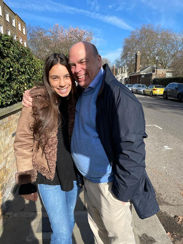 Hannah and Mike Lynch hugging in a street 