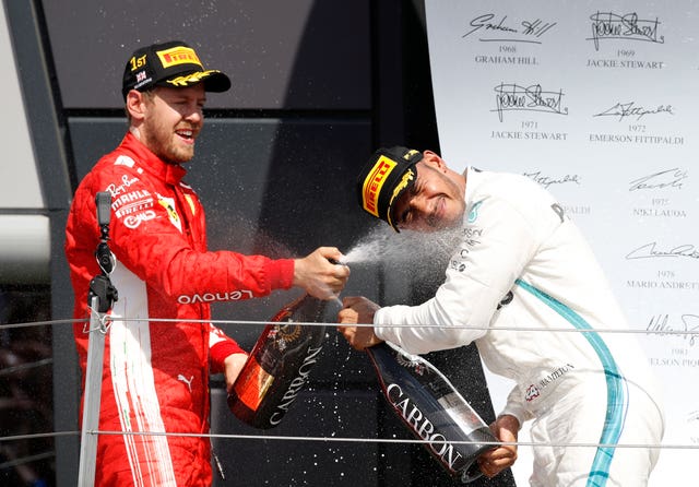 Lewis Hamilton, right, has been linked with succeeding Sebastian Vettel at Ferrari 