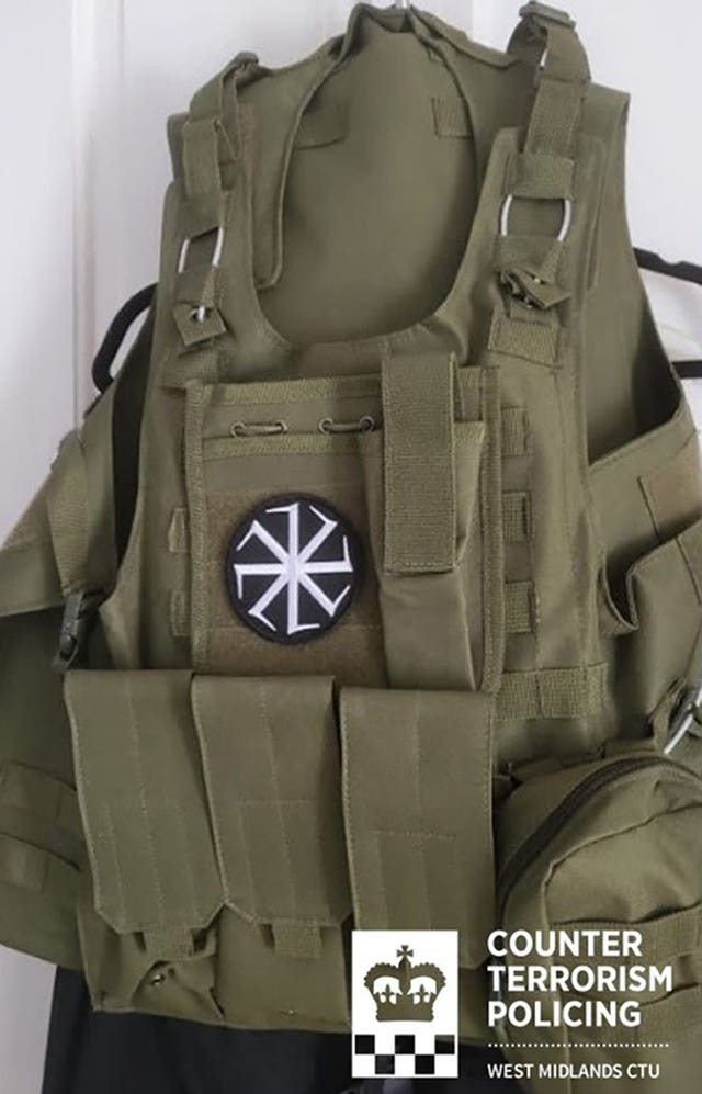 A tactical vest with a far-right symbol 