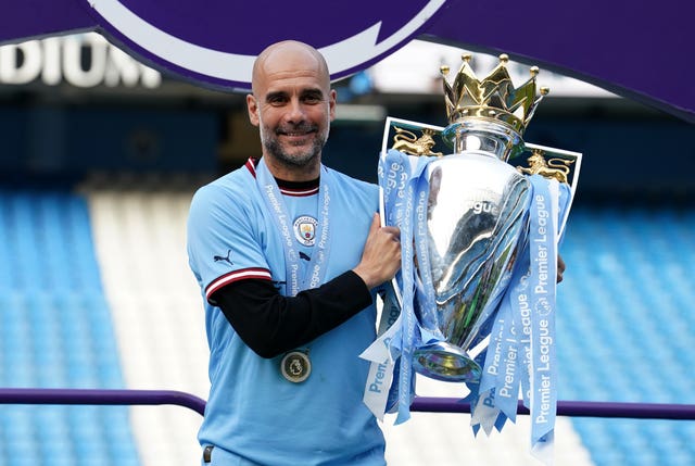 Pep Guardiola with the Premier League trophy