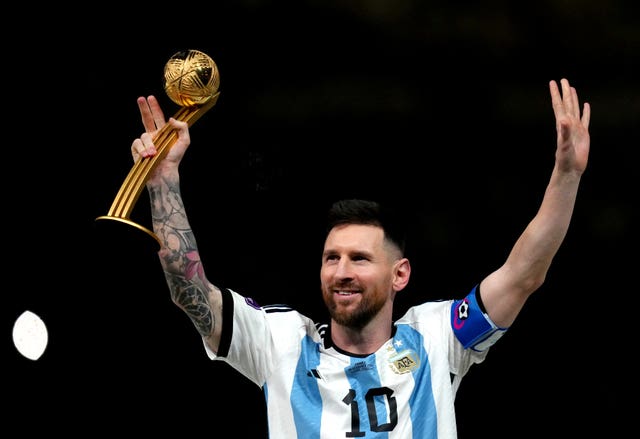 Argentina’s Lionel Messi celebrates after being presented with the Golden Ball award following victory in the FIFA World Cup final at Lusail Stadium, Qatar