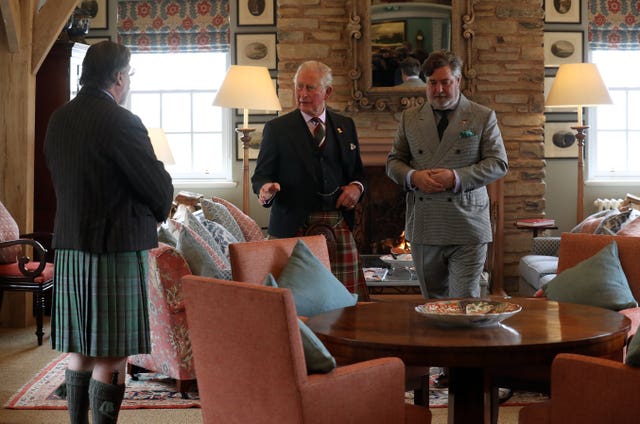 The Prince of Wales with Michael Fawcett (right) (Andrew Milligan/PA)