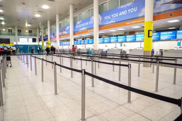 Empty Thomas Cook check-in desks at Gatwick Airport (Steve Parsons/PA)
