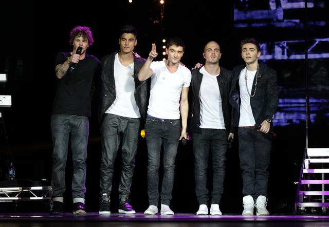 The five members of The Wanted standing on a stage in 2012