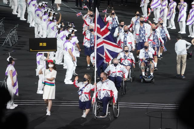 Great Britain flagbearers Ellie Simmonds, left, and John Stubbs during the opening ceremony of the Tokyo 2020 Paralympic Games