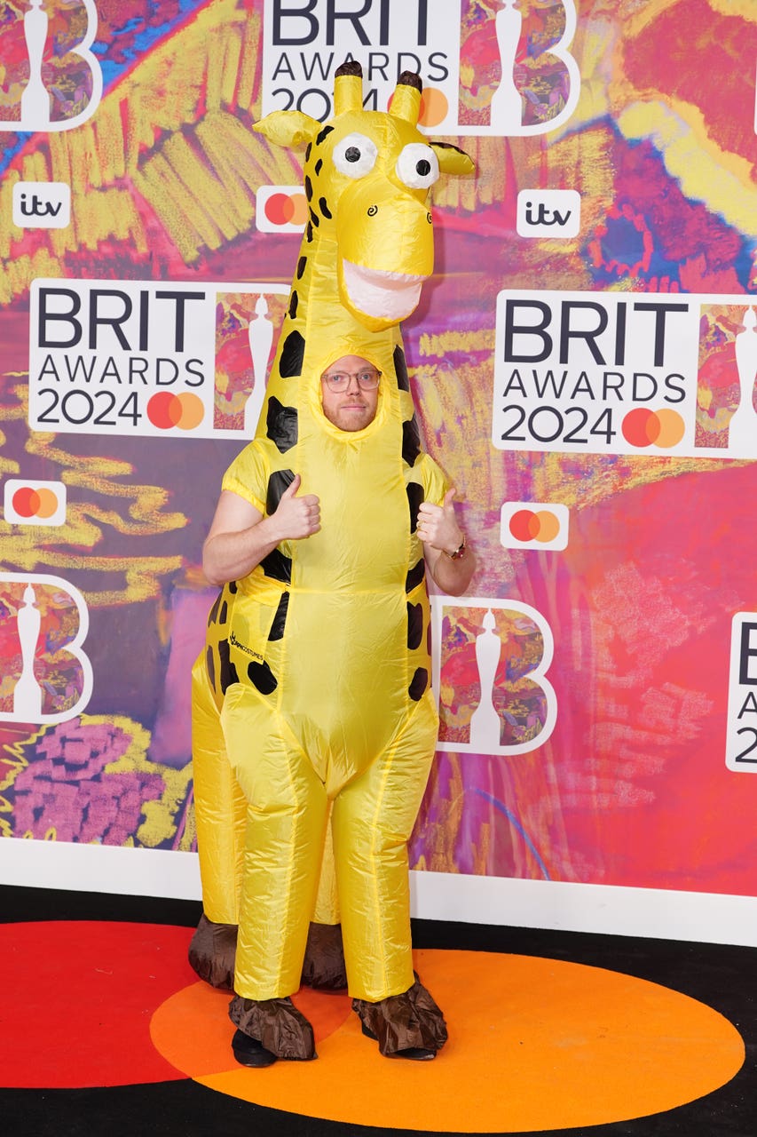 Rob Beckett turns up at Brit Awards in inflatable giraffe costume