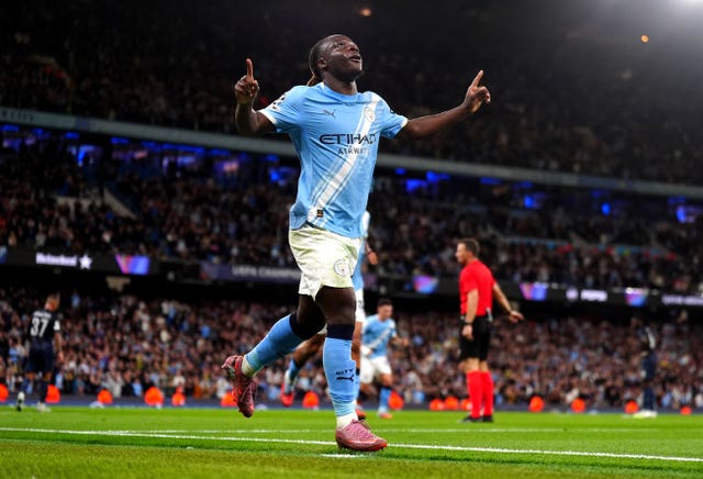 Jeremy Doku celebrates scoring