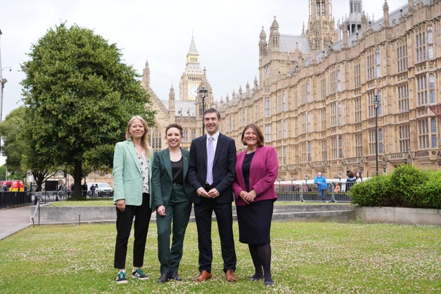 The four new Green MPs - Sian Berry, Carla Denyer, Adrian Ramsay and Ellie Chowns - pose in front of the Palace of Westminster