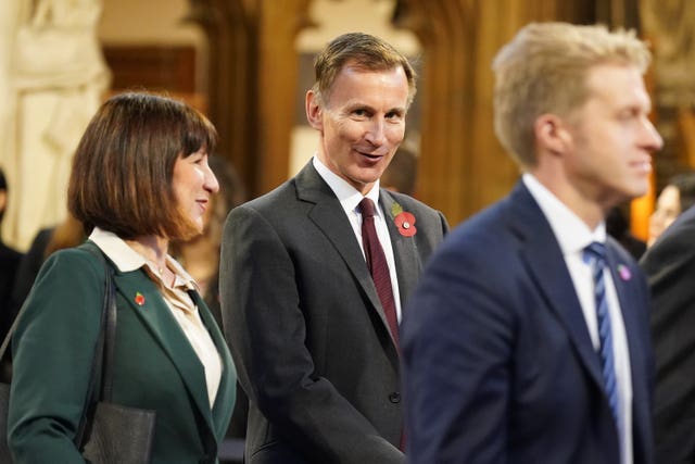 Rachel Reeves, left, with Jeremy Hunt, centre