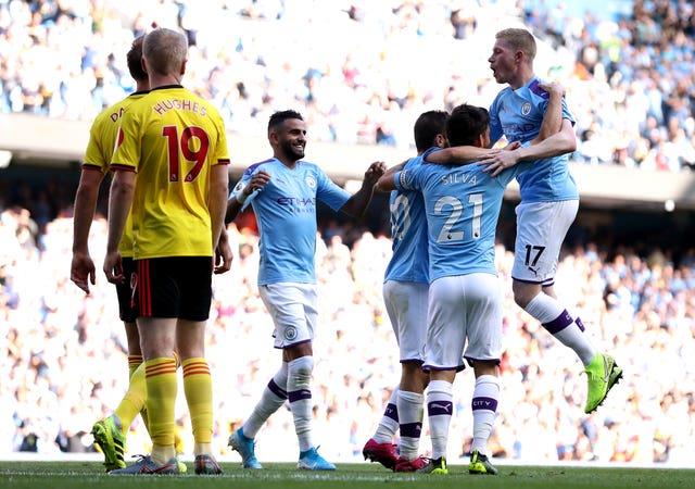 Manchester City celebrate Bernardo Silva's second goal and their sixth against Watford