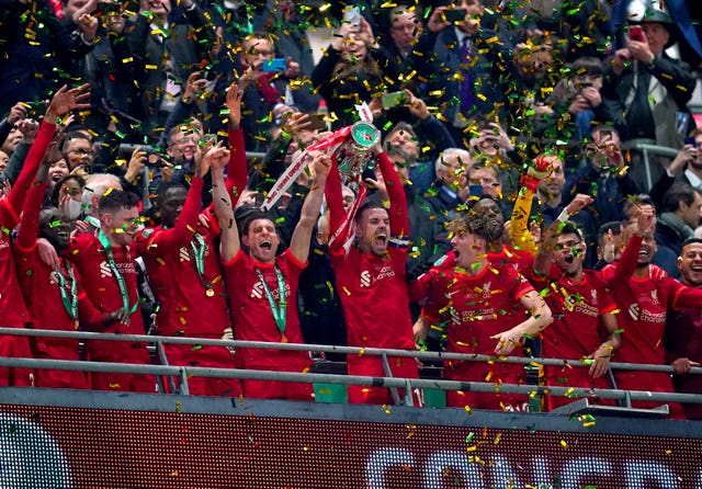 Liverpool’s Jordan Henderson lifts the Carabao Cup trophy