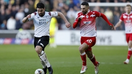 Derby County’s Eiran Cashin (left) and Barnsley’s Adam Phillips battle for the ball during the Sky Bet League One match at Oakwell, Barnsley. Picture date: Saturday February 24, 2024.