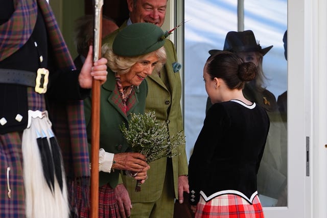 Camilla holding heather with a young girl