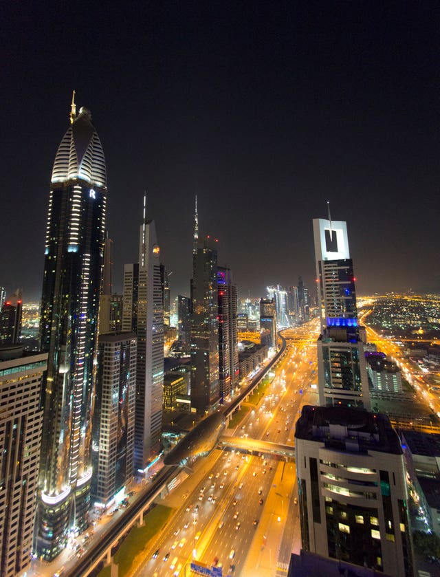 Dubai is home to many skyscrapers, here seen at night (Yui Mok/PA)