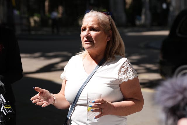 Kim Smith, sister of Peter Sullivan, outside trhe Royal Courts of Justice (Ben Whitley/PA)