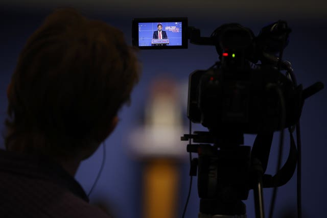 Prime Minister Rishi Sunak is seen on the screen of a camera as he delivers a speech setting out how he will address the dangers presented by artificial intelligence while harnessing its benefits at the Royal Society, Carlton House Terrace, in London