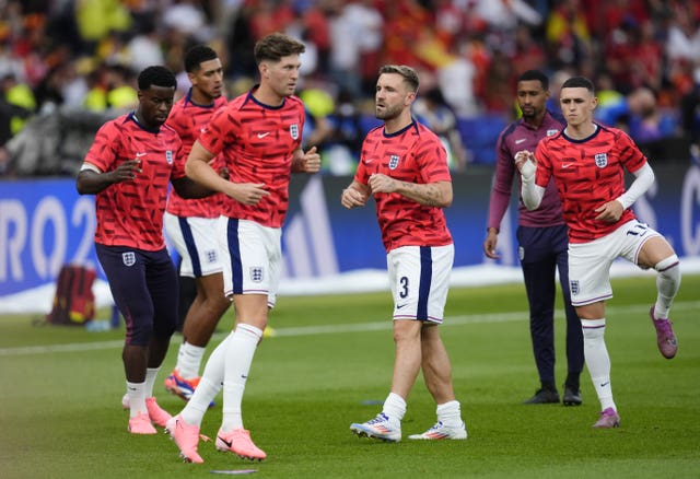 England’s Luke Shaw (centre) and Phil Foden (right) warming up