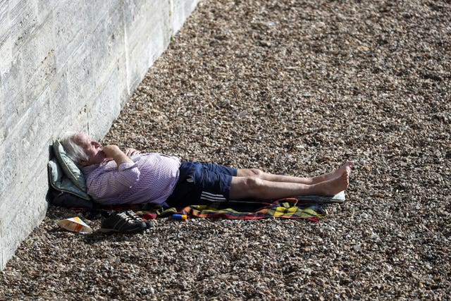 A man sunbathes in Old Portsmouth, Hampshire