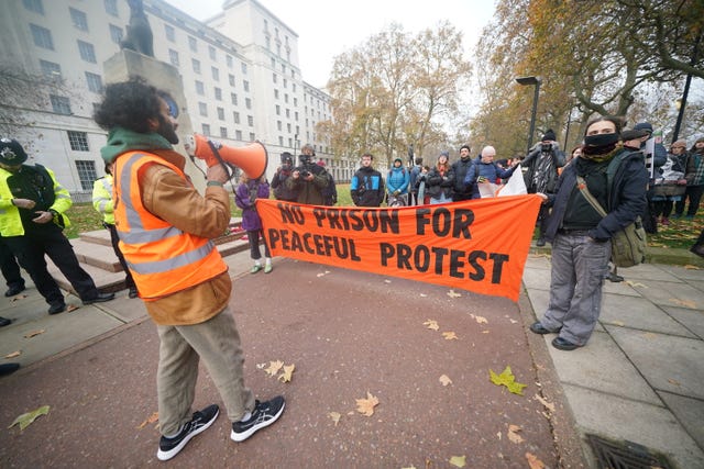 Just Stop Oil protesters demonstrate outside New Scotland Yard