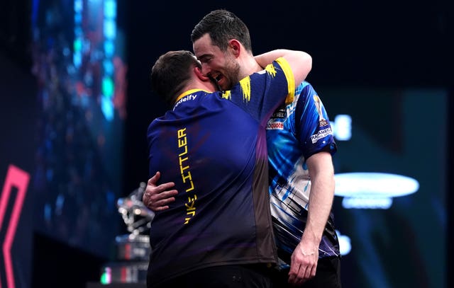 Luke Littler and Luke Humphries after their match during day four of the Winmau World Masters at Arena MK, Milton Keynes
