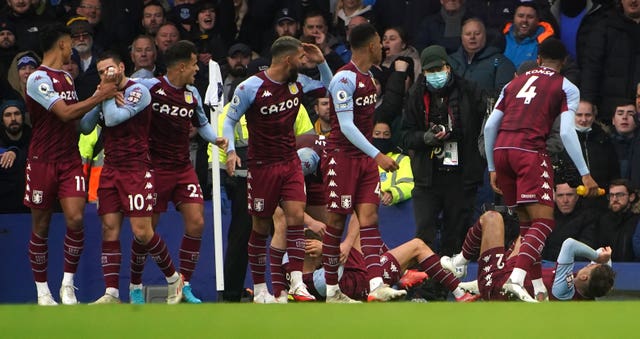 Aston Villa’s Lucas Digne and Matty Cash react to being hit by a missile at Goodison Park