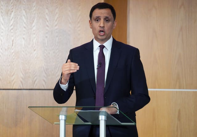 Anas Sarwar speaking from a lectern