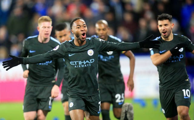 Raheem Sterling celebrates scoring the winner against Huddersfield 