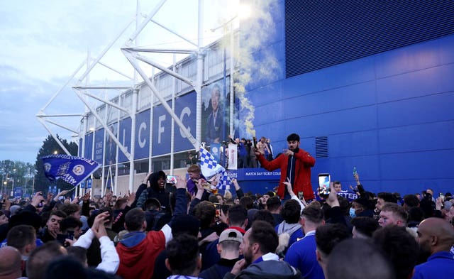 Leicester City fans celebrate victory in the FA Cup Final outside the King Power Stadium. 