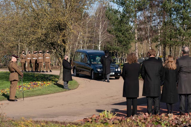 The funeral cortege arrives for the service