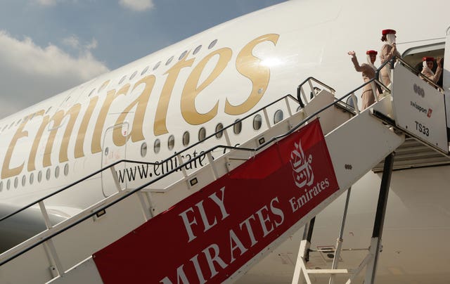 Air stewardesses leave an Emirates Airbus A380 (Dave Thompson/PA)