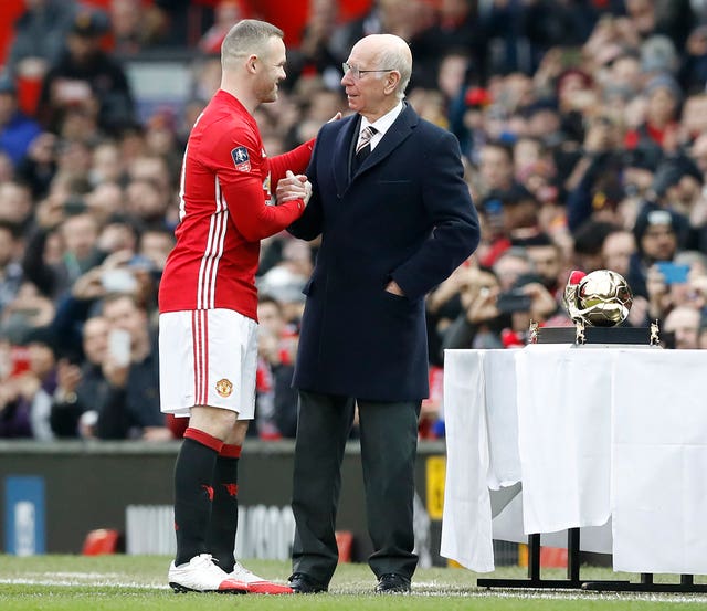Wayne Rooney was presented with a Golden Boot by Sir Bobby Charlton after he become Manchester United's all-time leading goalscorer