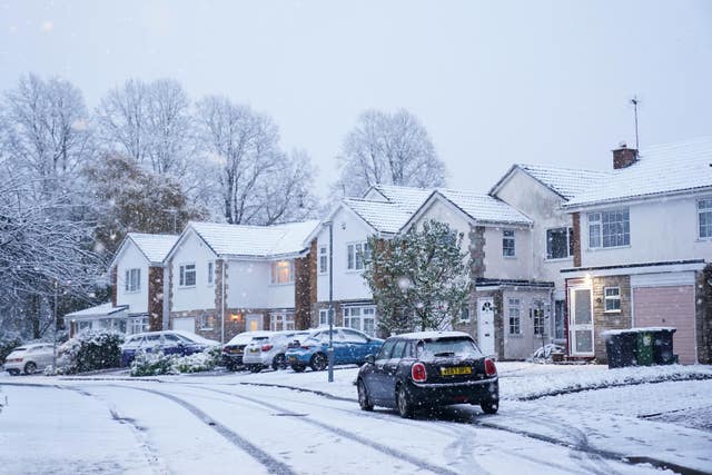 Snowy street and homes