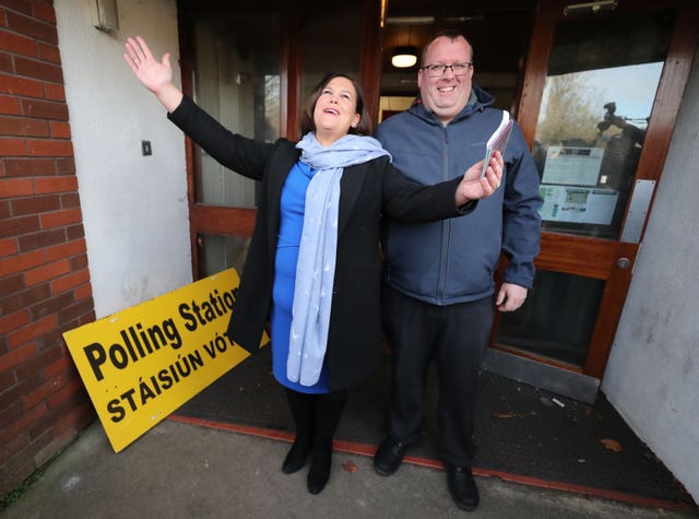 Sinn Fein president Mary Lou McDonald, with local councillor Seamas McGrattan, votes at St Joseph’s School in Dublin 