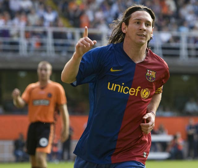 Lionel Messi celebrates after scoring for Barcelona in a pre-season friendly at Dundee United