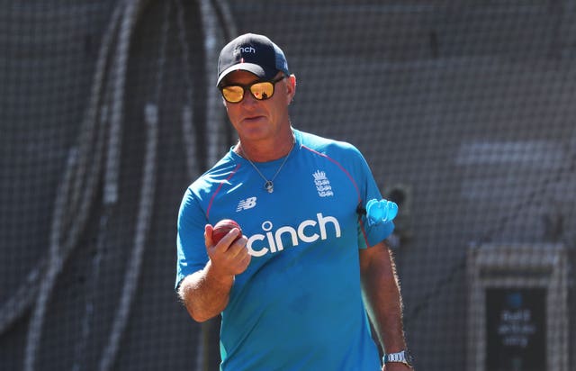 Graham Thorpe wearing sunglasses and and England training top