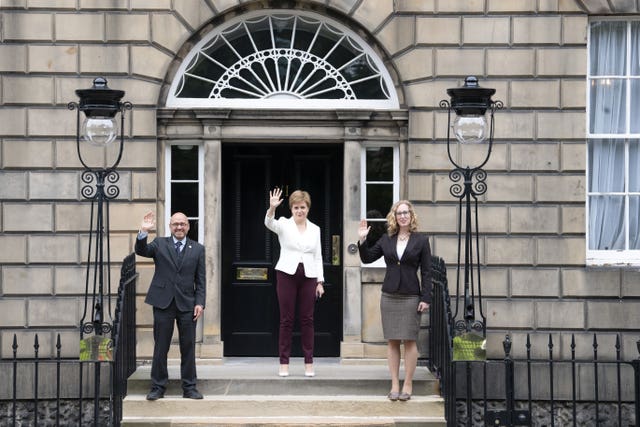 Nicola Sturgeon (centre) welcomes Scottish Green co-leaders Patrick Harvie and Lorna Slater at Bute House