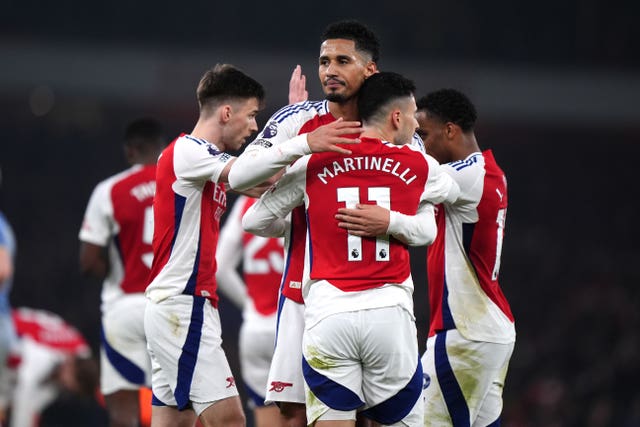 Arsenal players celebrate at full-time