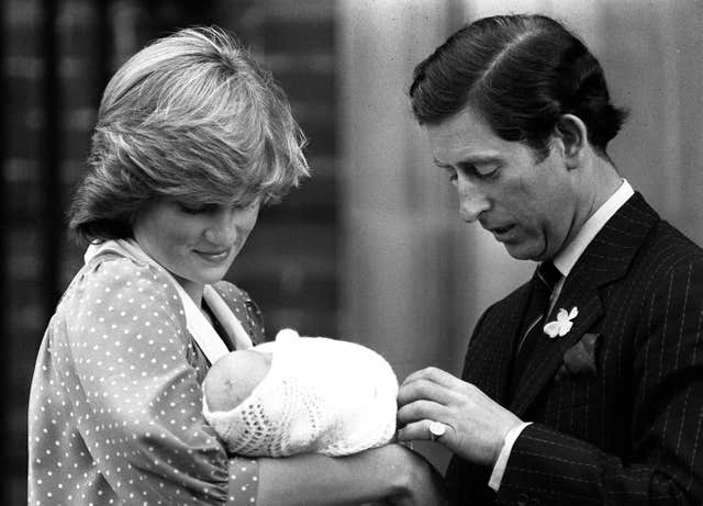 The Prince and Princess of Wales showing off their son, Prince William, to the media for the first time