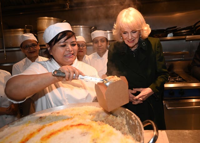 Camilla helps pack donation boxes 