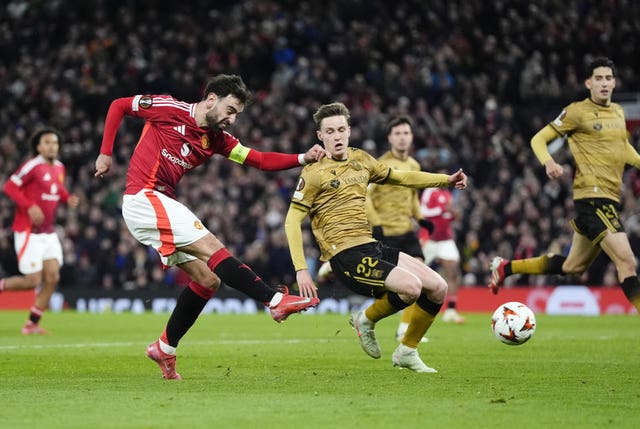 Bruno Fernandes shoots right footed towards goal as he scores his hat-trick